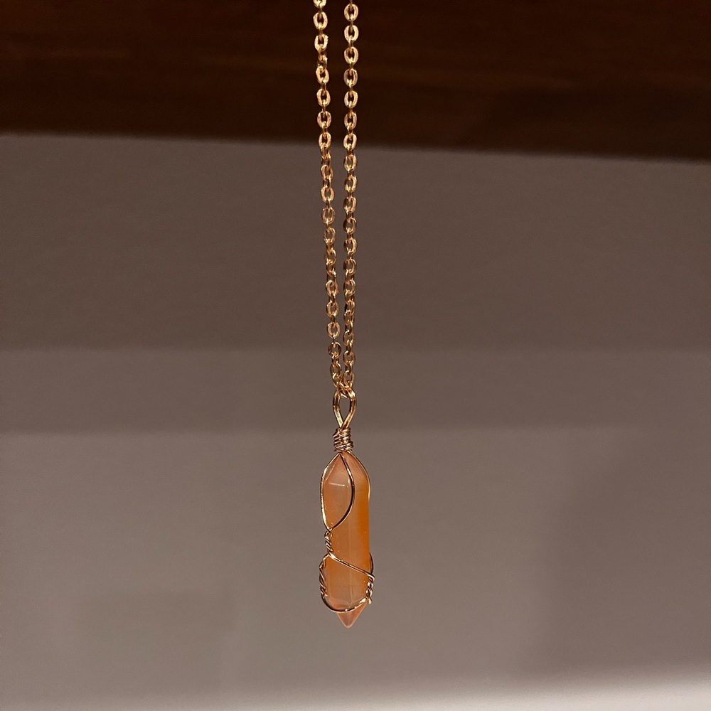 Pink crystal necklace with a gold chain
